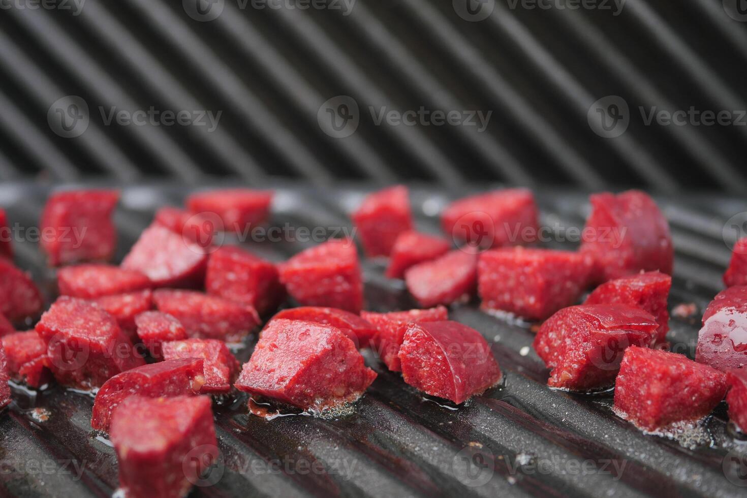 slice of salami sausage on the grill photo