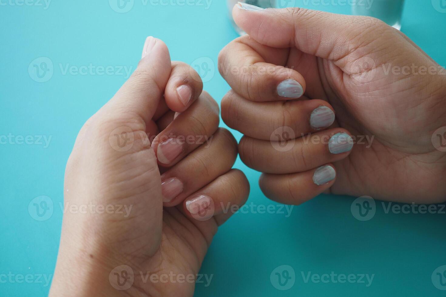 putting nail polish on nail , photo