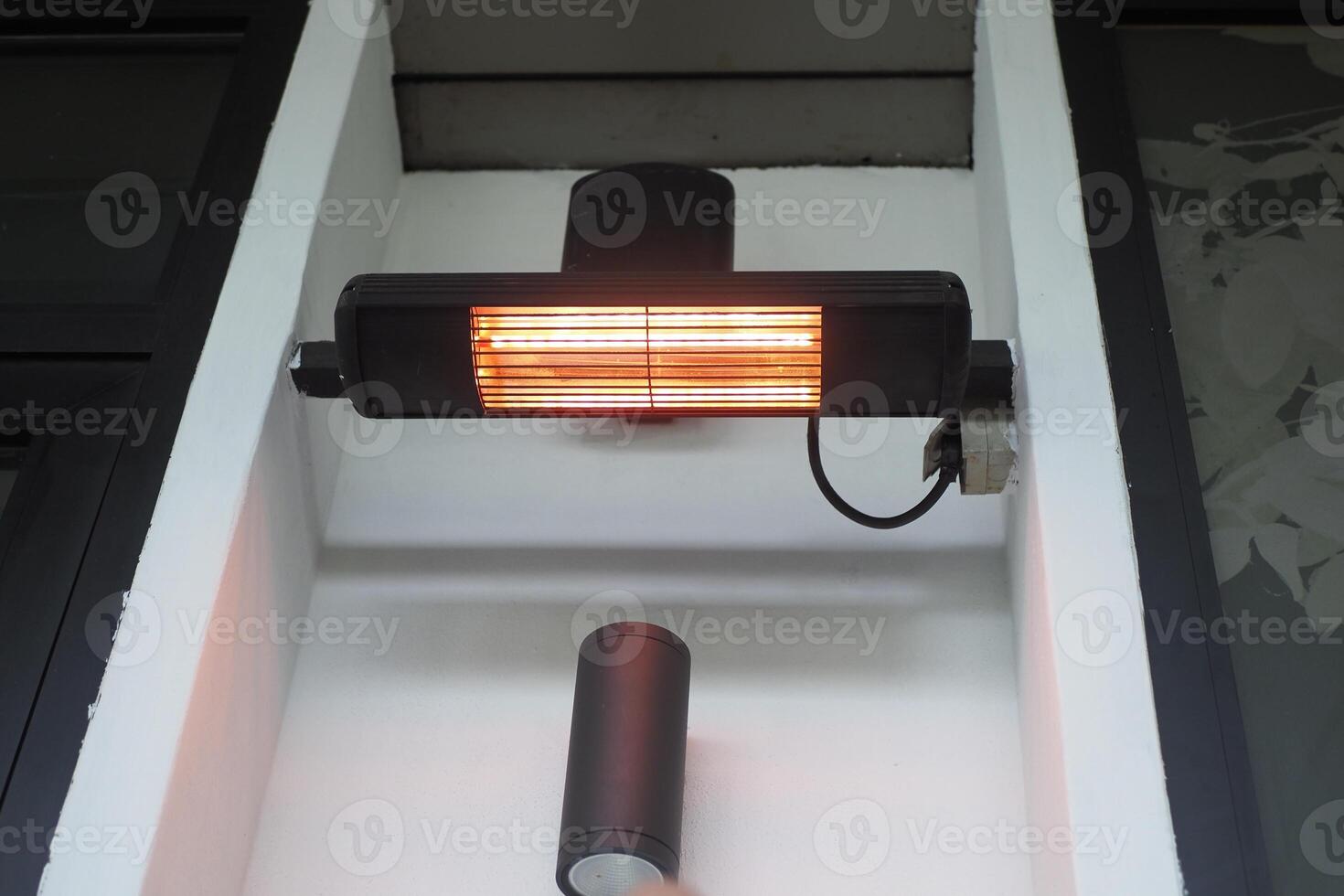 Modern electric infrared heater on celling photo