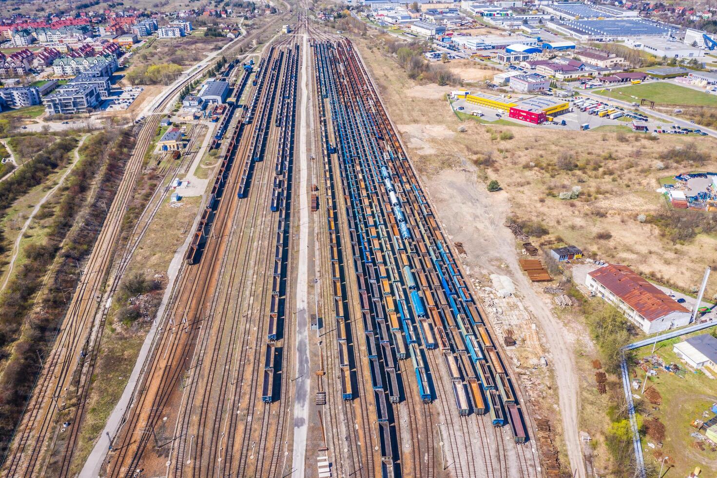 Cargo trains. Aerial view of colorful freight trains on the railway station. Wagons with goods on railroad.Aerial view photo