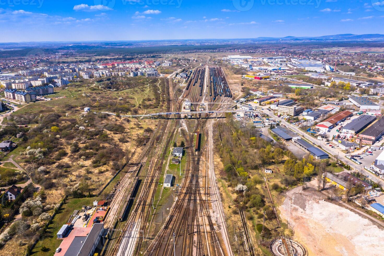 Cargo trains. Aerial view of colorful freight trains on the railway station. Wagons with goods on railroad.Aerial view photo