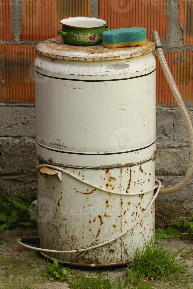 old washing machine in a garden, outdoors photo