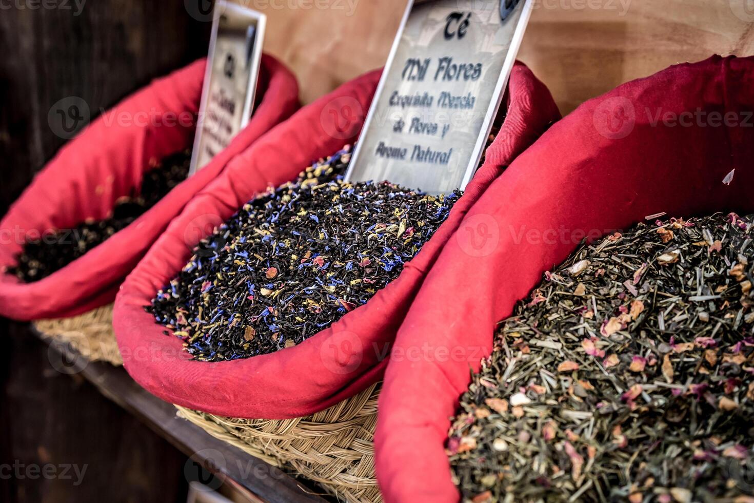 Spices, seeds and tea sold in a traditional market in Granada, Spain photo