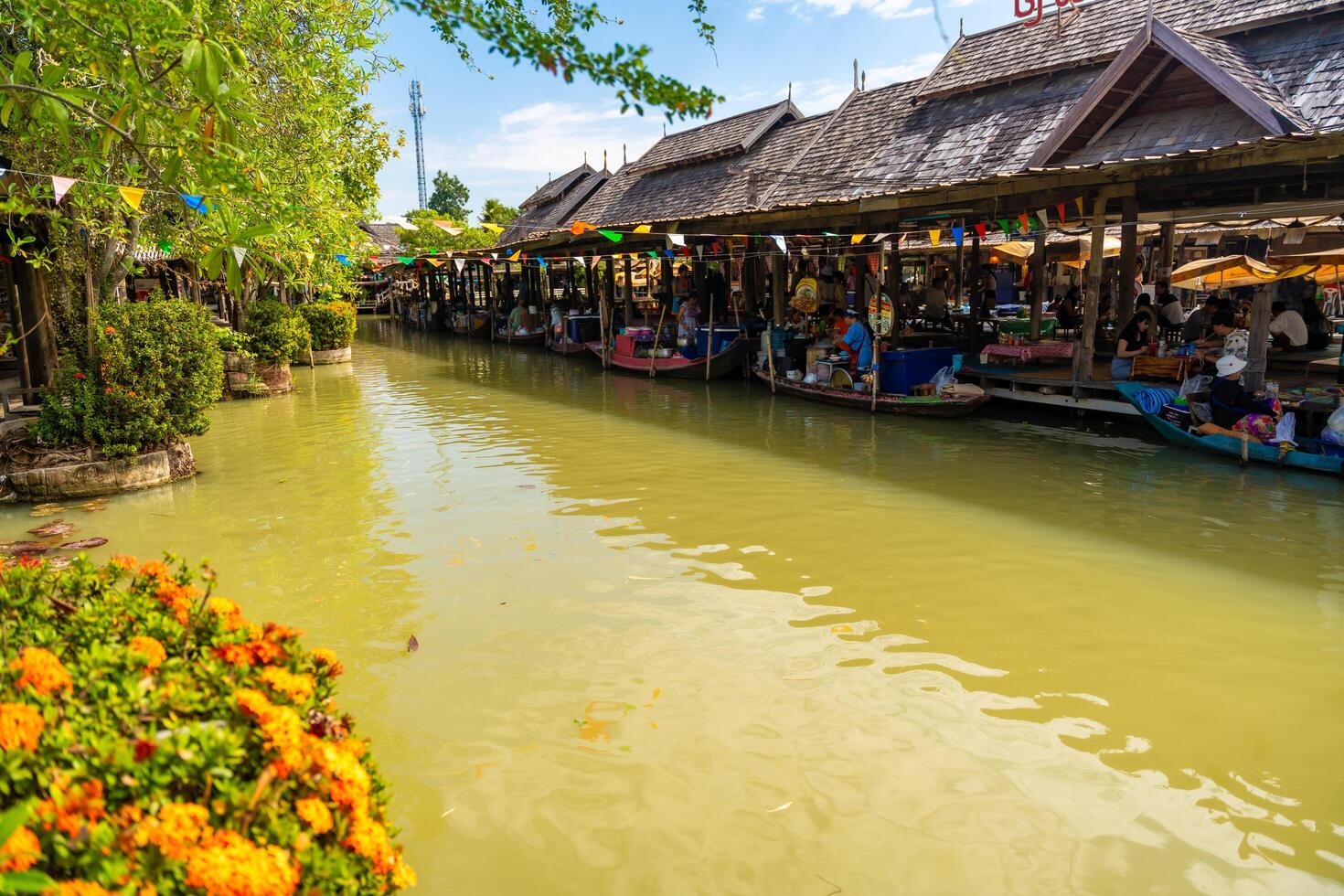 Pattaya, Thailand - December 29, 2023. Floating open air market with small houses - shops on the pond in Pattaya, Thailand photo