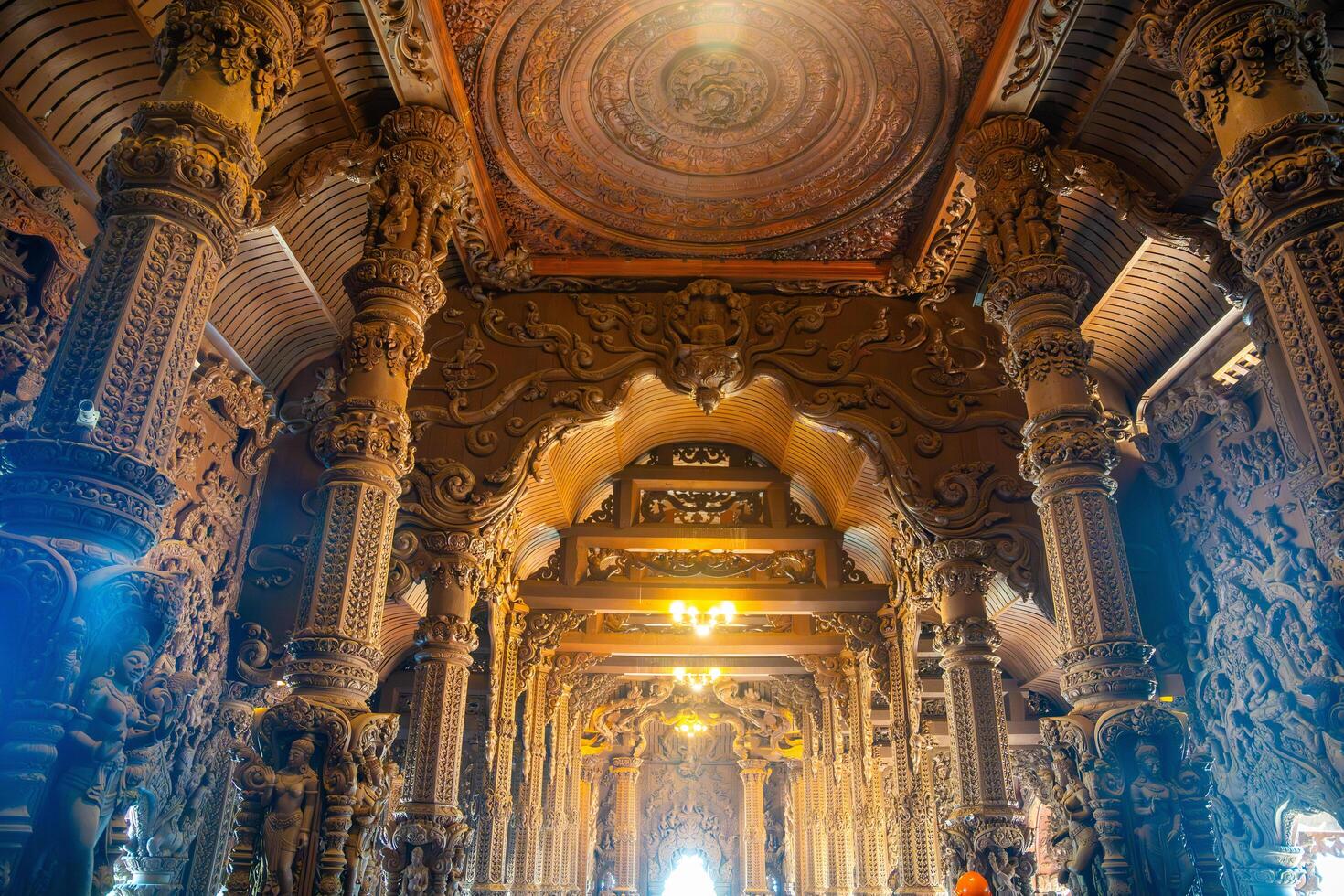 Pattaya, Thailand - December 31, 2023. Interior of Sanctuary of Truth wooden temple in Pattaya, Thailand. Sanctuary of Truth temple. photo