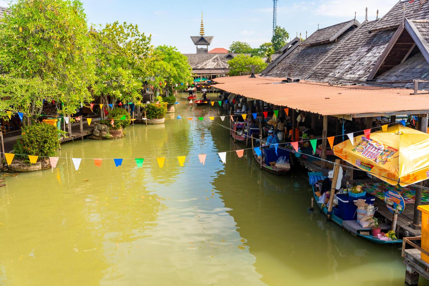 Pattaya, Thailand - December 29, 2023. Floating open air market with small houses - shops on the pond in Pattaya, Thailand. High quality photo