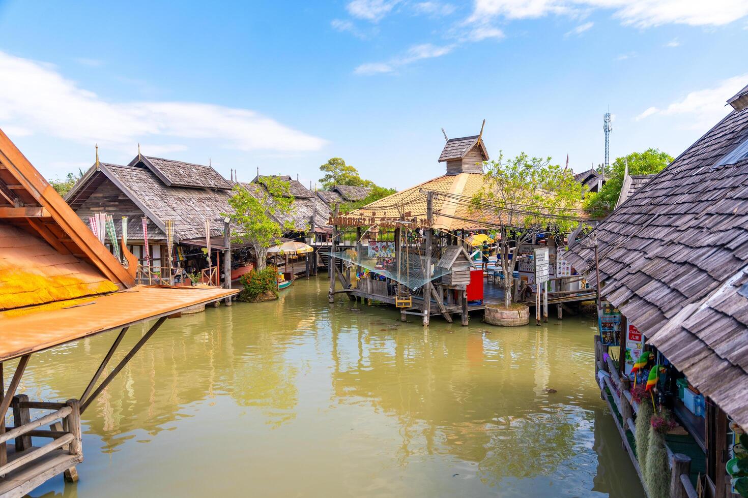 Pattaya, Thailand - December 29, 2023. Floating open air market with small houses - shops on the pond in Pattaya, Thailand. High quality photo