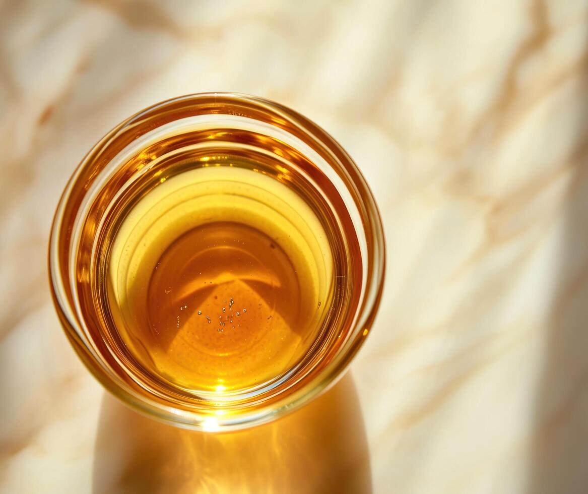 AI generated bottled honey in a cup on a white surface photo