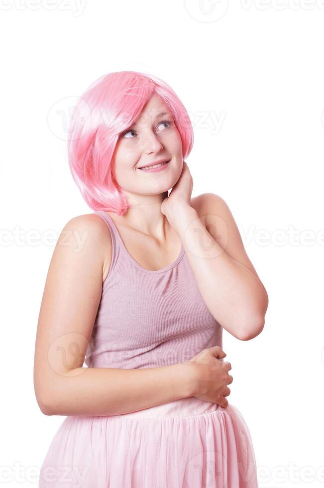 cute young woman with pink wig thinking photo