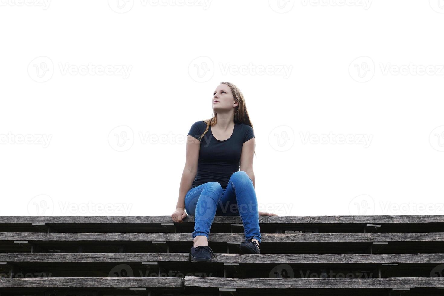 young woman is lost in thought photo