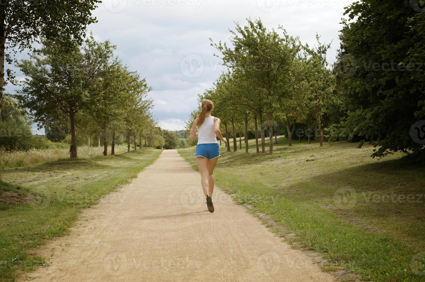 young woman jogging photo
