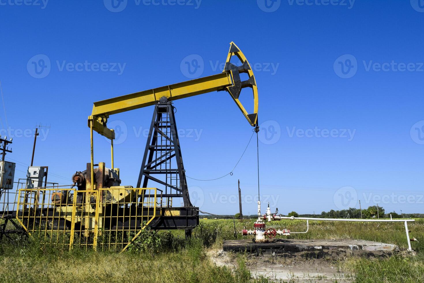 Pumping unit as the oil pump installed on a well photo