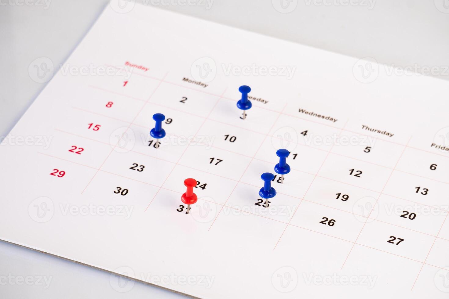 business desk calendar with pins photo