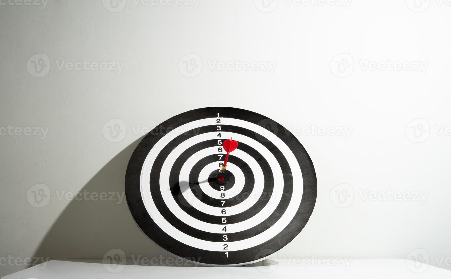 target with red arrow on the table photo