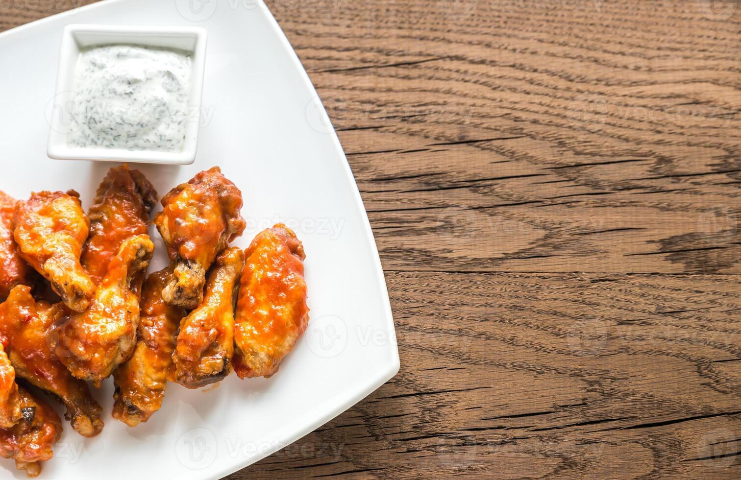 Portion of buffalo chicken wings photo