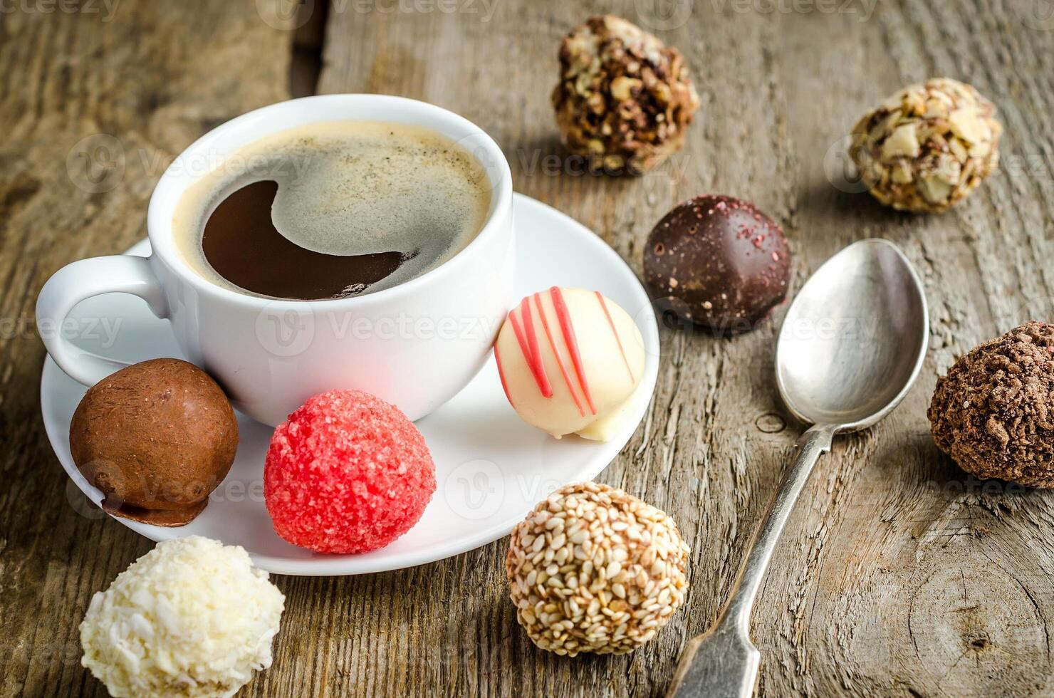 Luxury chocolate candies and cup of coffee photo