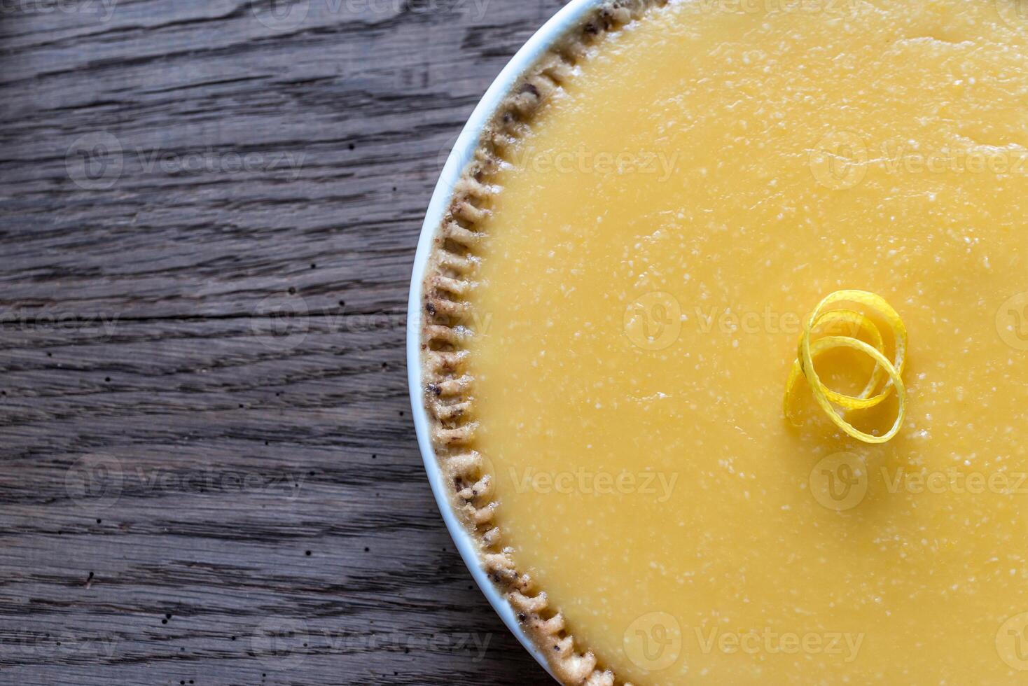 Lemon tart on the wooden background photo