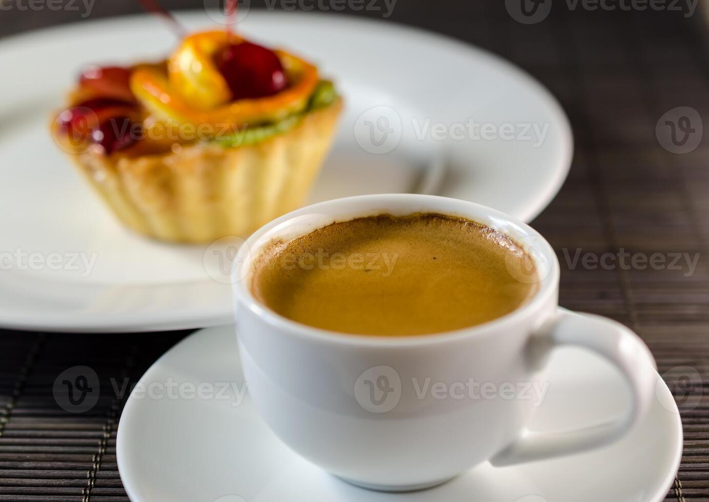 Cup of espresso and dessert photo
