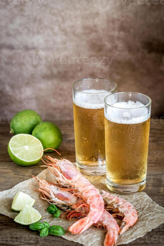 Shrimps with glasses of beer photo