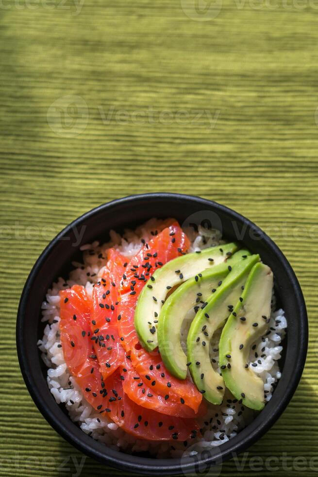 White rice with salmon and avocado photo