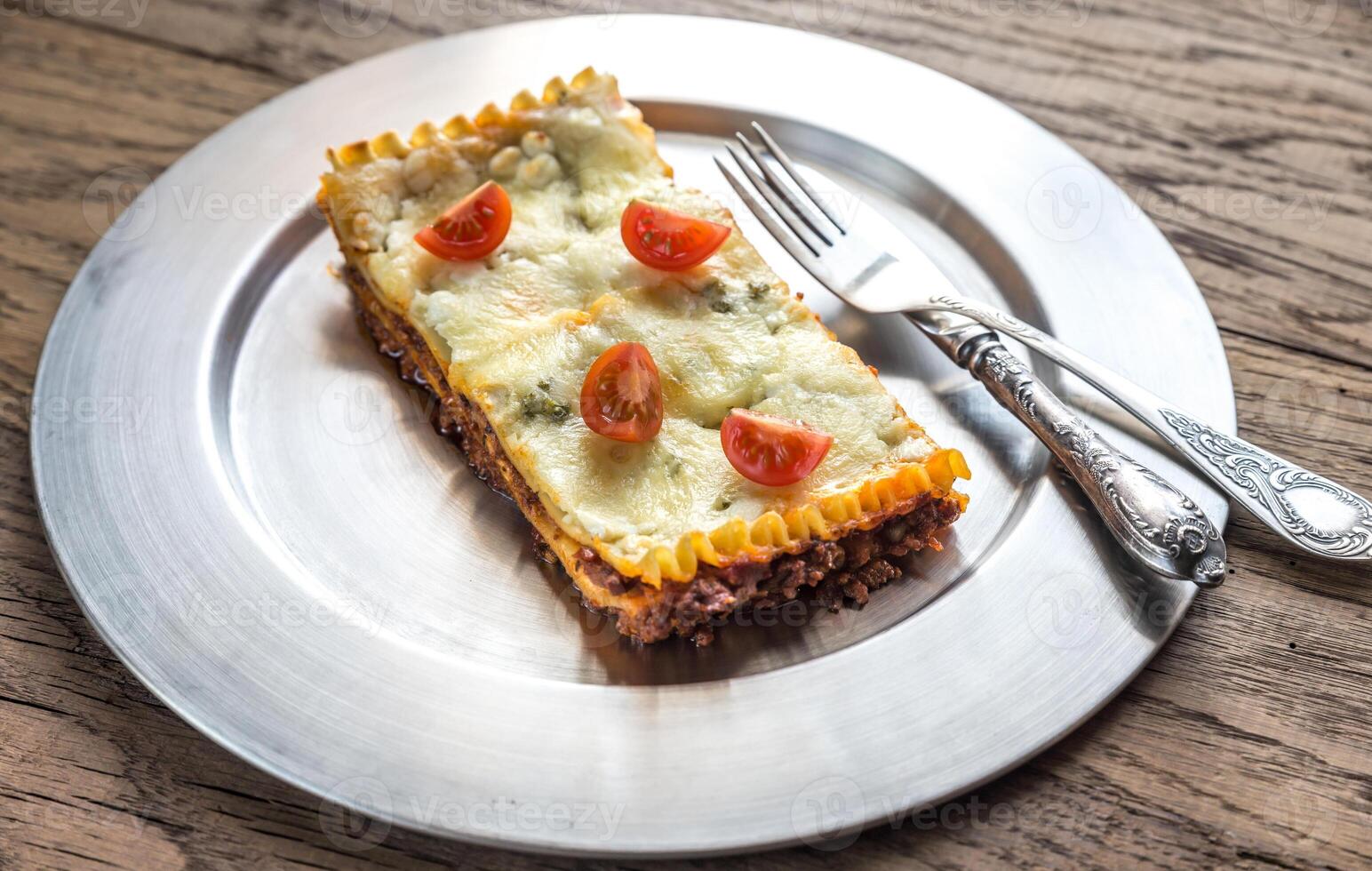 Lasagna on the metal plate photo