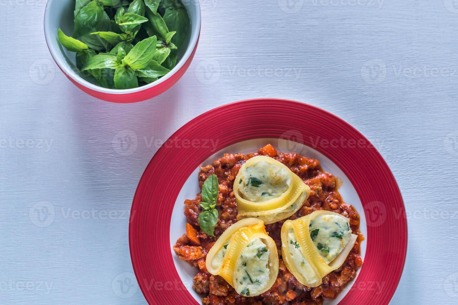 Lumaconi stuffed with ricotta with bolognese sauce photo