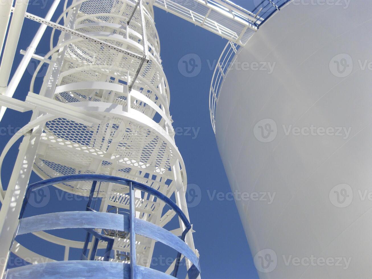 The tank with water and a ladder. photo