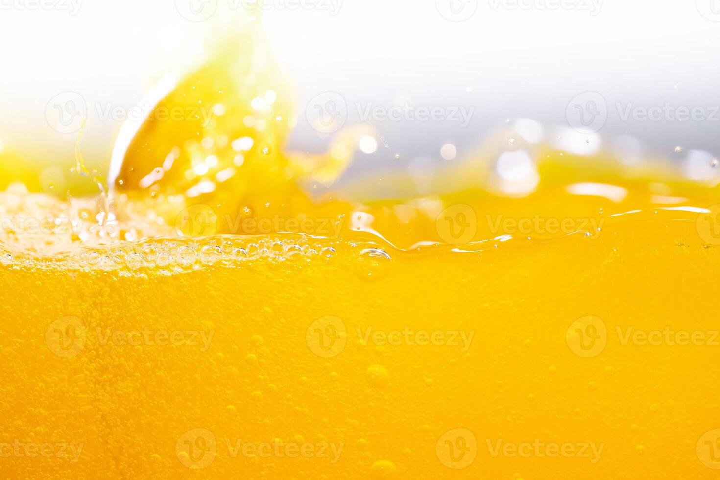 Close up bright orange juice splash texture for health and nature waves, Beautiful waves curve and little bubbles smooth for garphic design and background photo