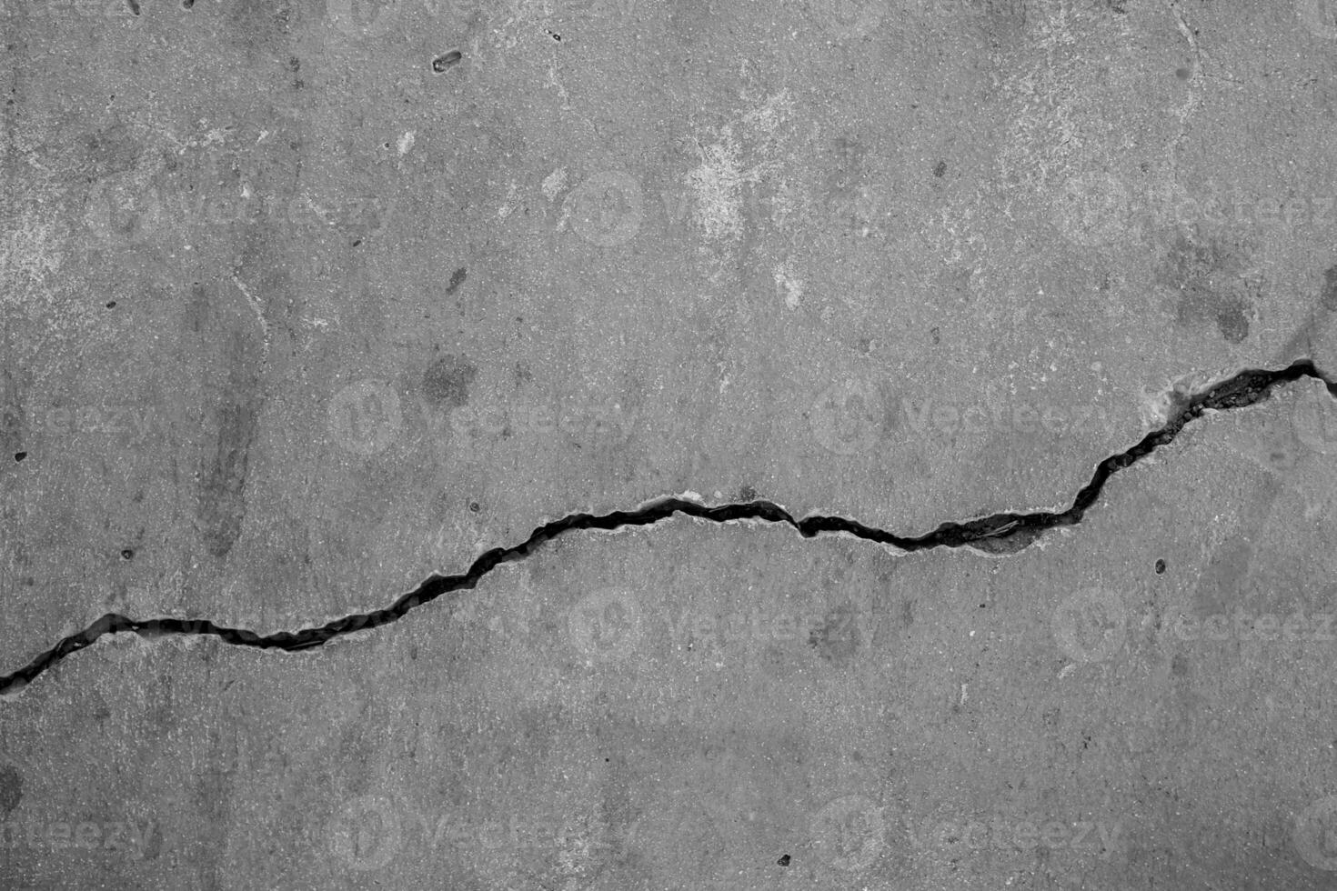 Cracked concrete wall broken wall at the outside cement corner that effected with earthquake and collapsed ground photo