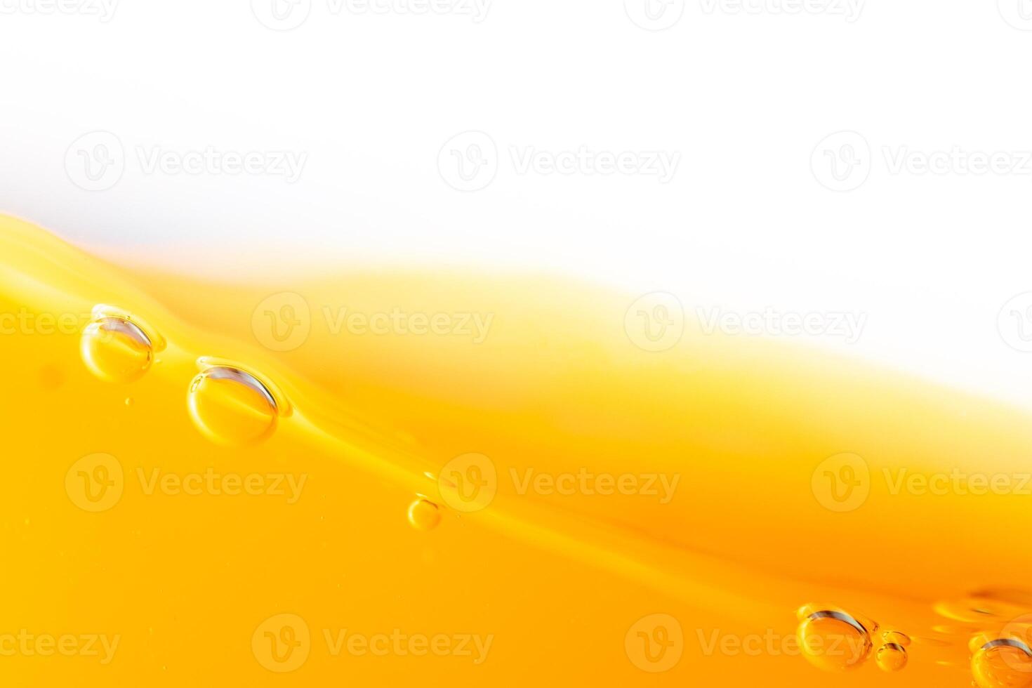 Close up bright orange juice splash texture for health and nature waves, Beautiful waves curve and little bubbles smooth for garphic design and background photo