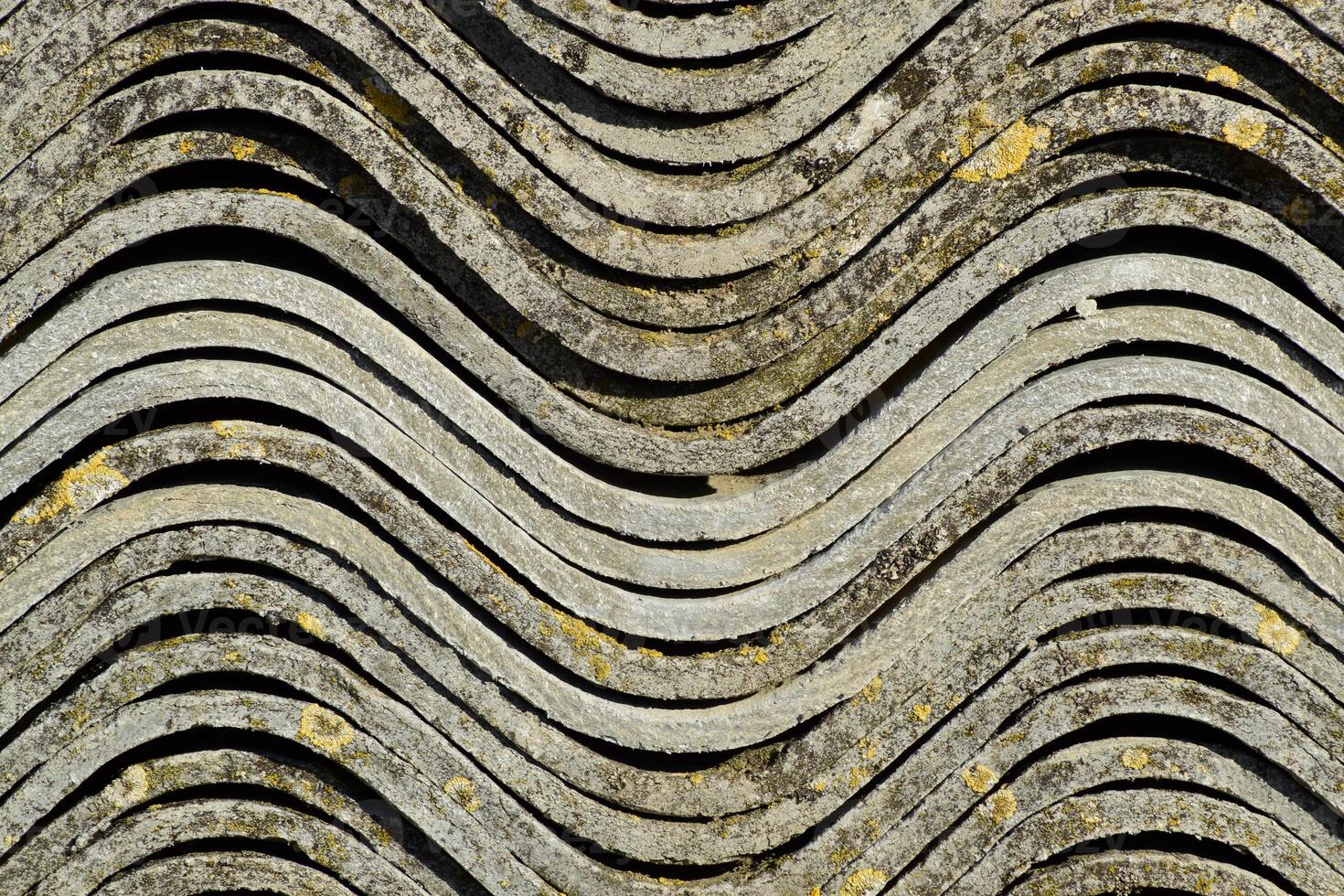 Corrugated slate lies in a pile, side view background texture of slate. photo