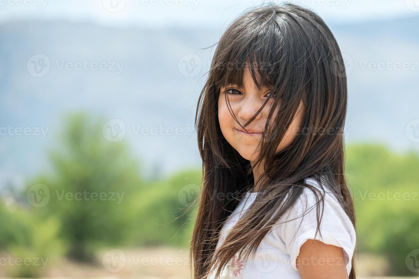 Portrait of a long-haired Latin girl. photo