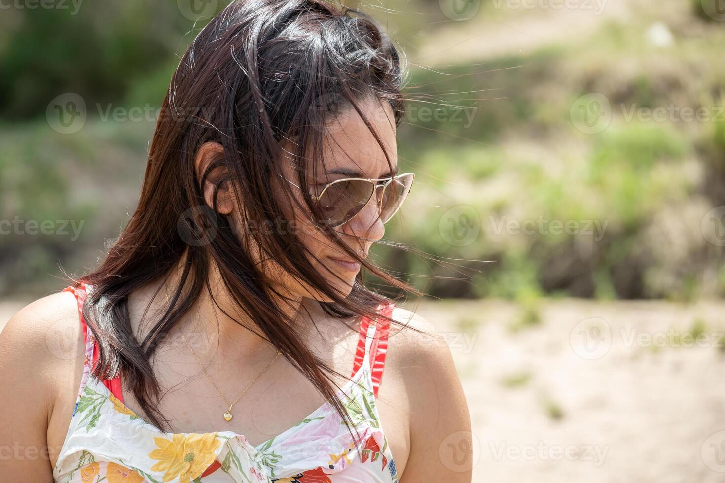 Tourist woman relaxing walking along a river in Argentina. photo