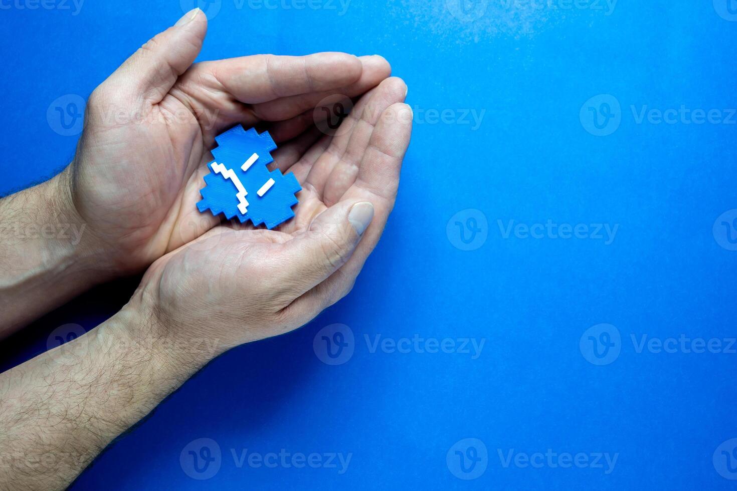 Blue Monday Concept. Hands of a man holding a blue heart. photo
