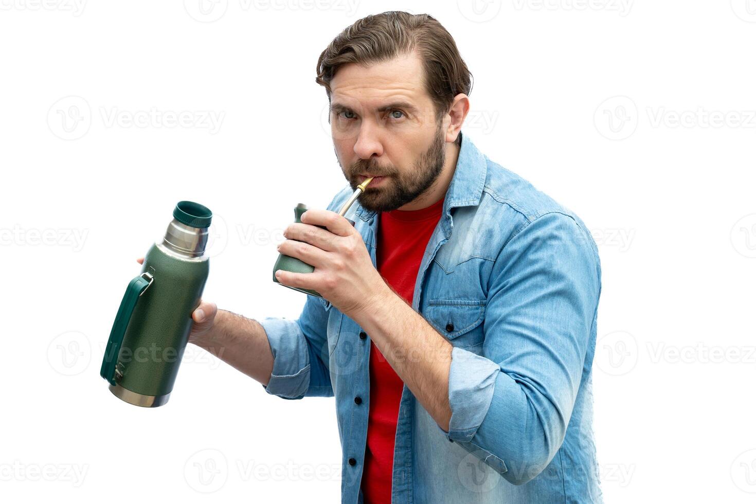 Man drinking mate looking at the camera. photo