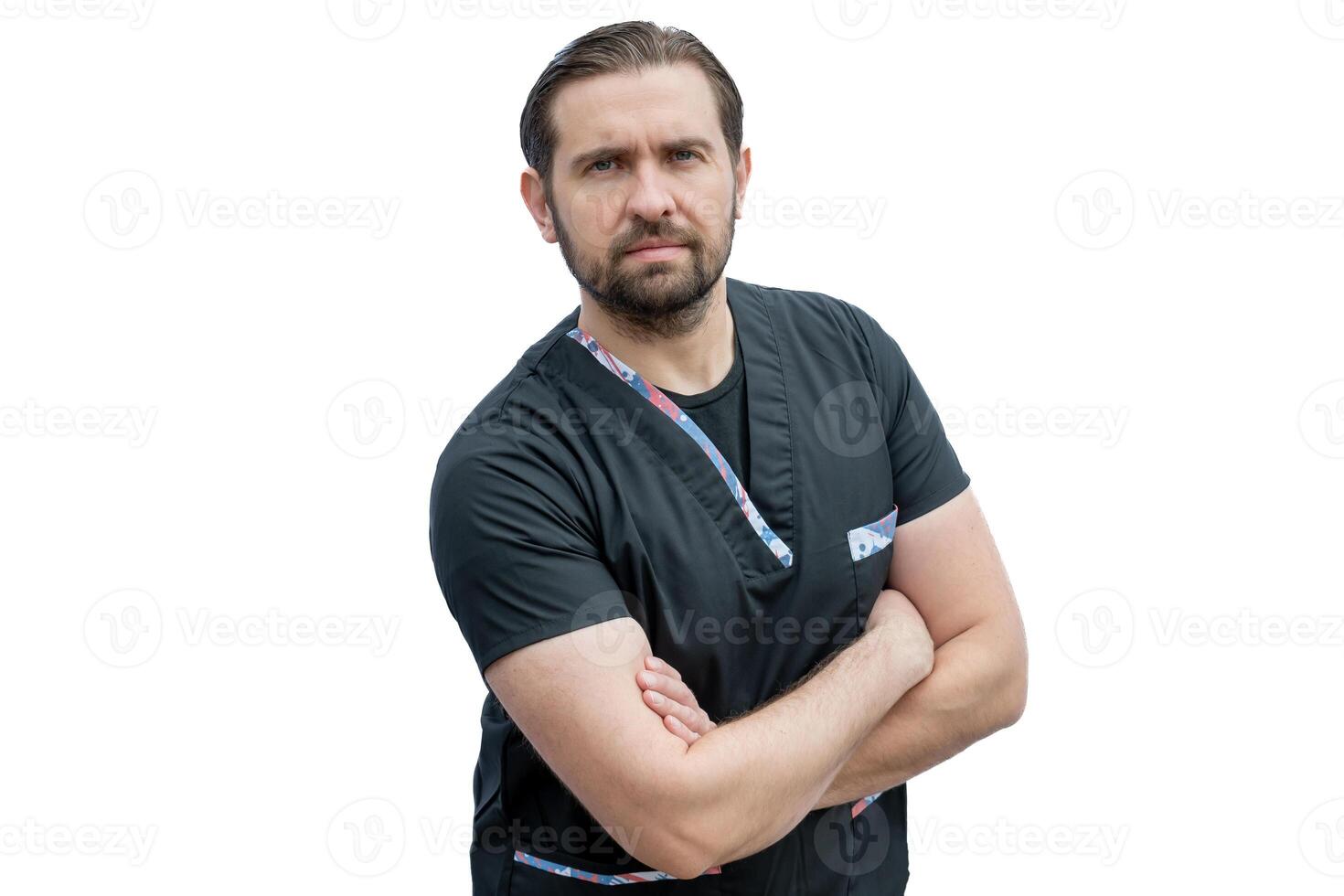 Portrait of a male nurse crossing his arms looking at the camera. photo