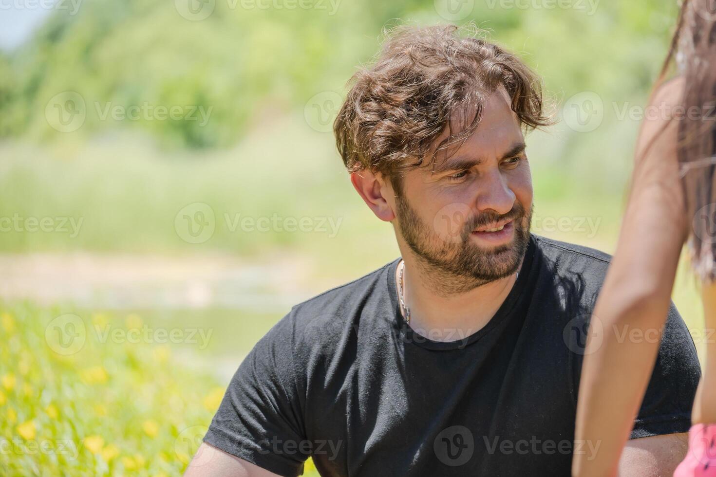 Portrait of an Argentinian Caucasian man in a green meadow. photo