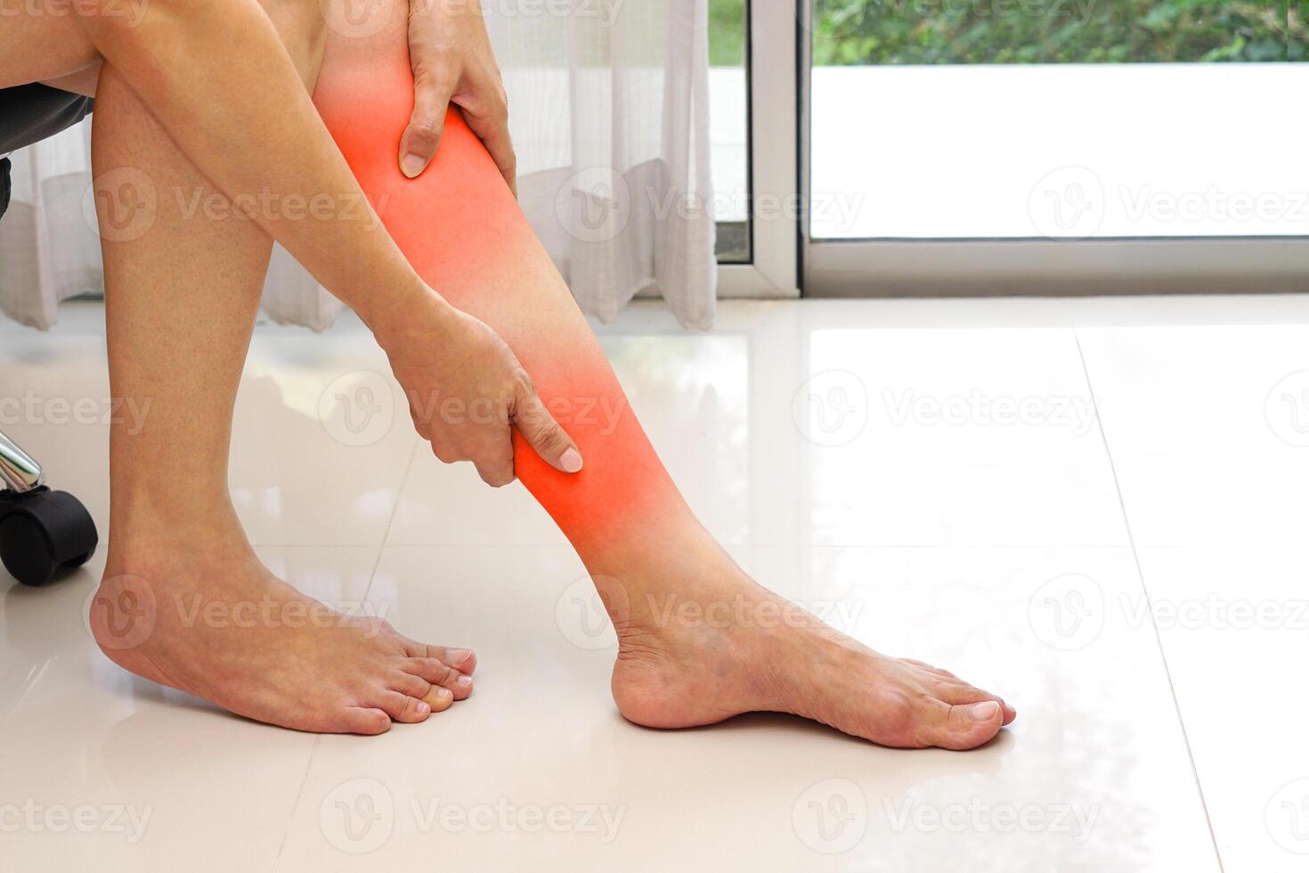Woman suffering from leg pain. Medical and health concept. photo