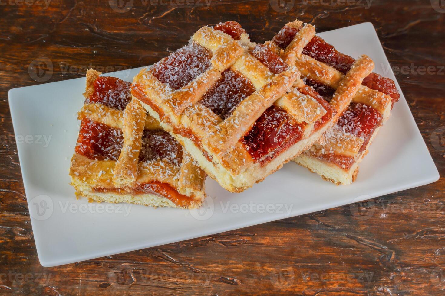 Homemade quince frola pasta in squares on wood photo