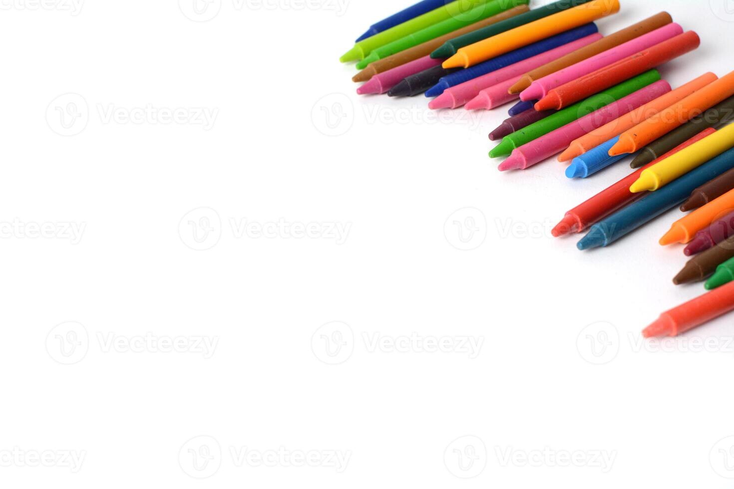 Crayons lined up isolated on white background. photo