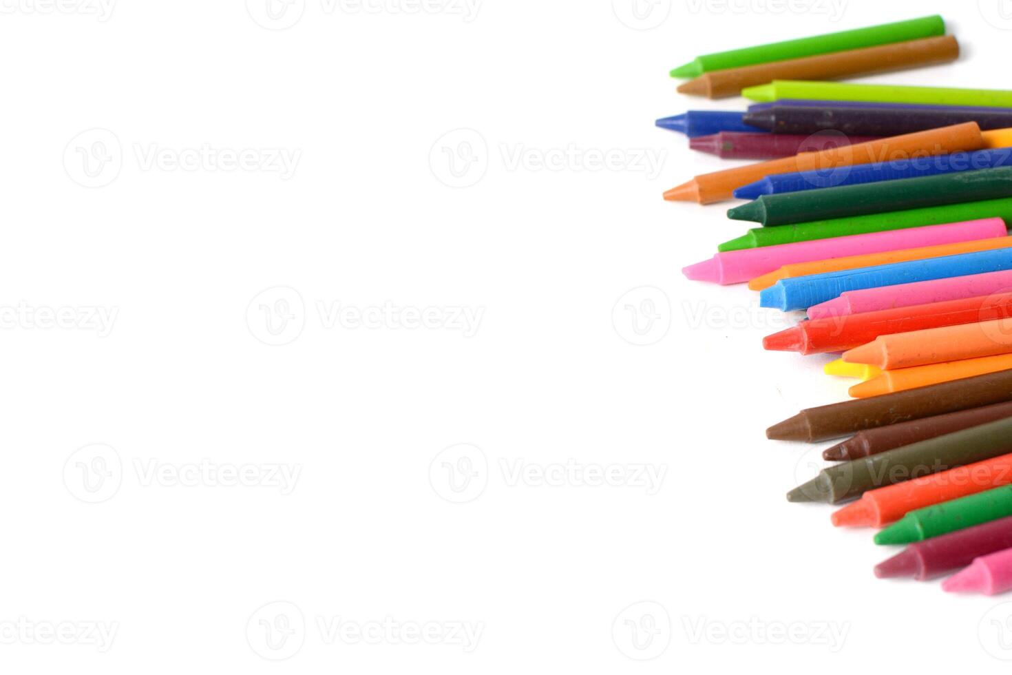 Crayons lined up isolated on white background. photo