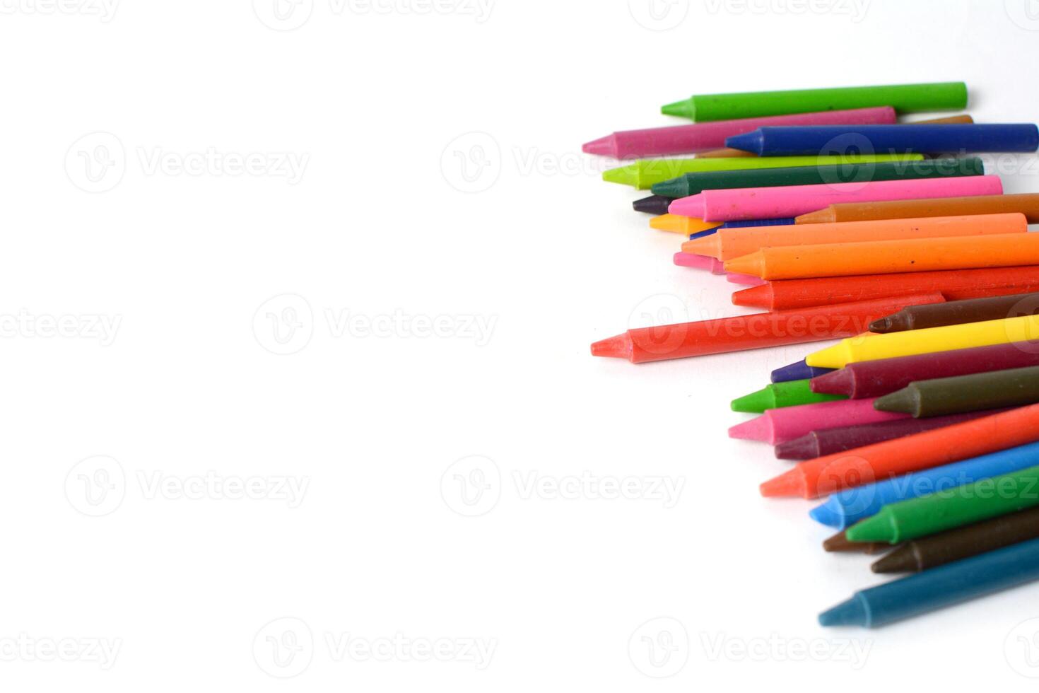 Crayons lined up isolated on white background. photo