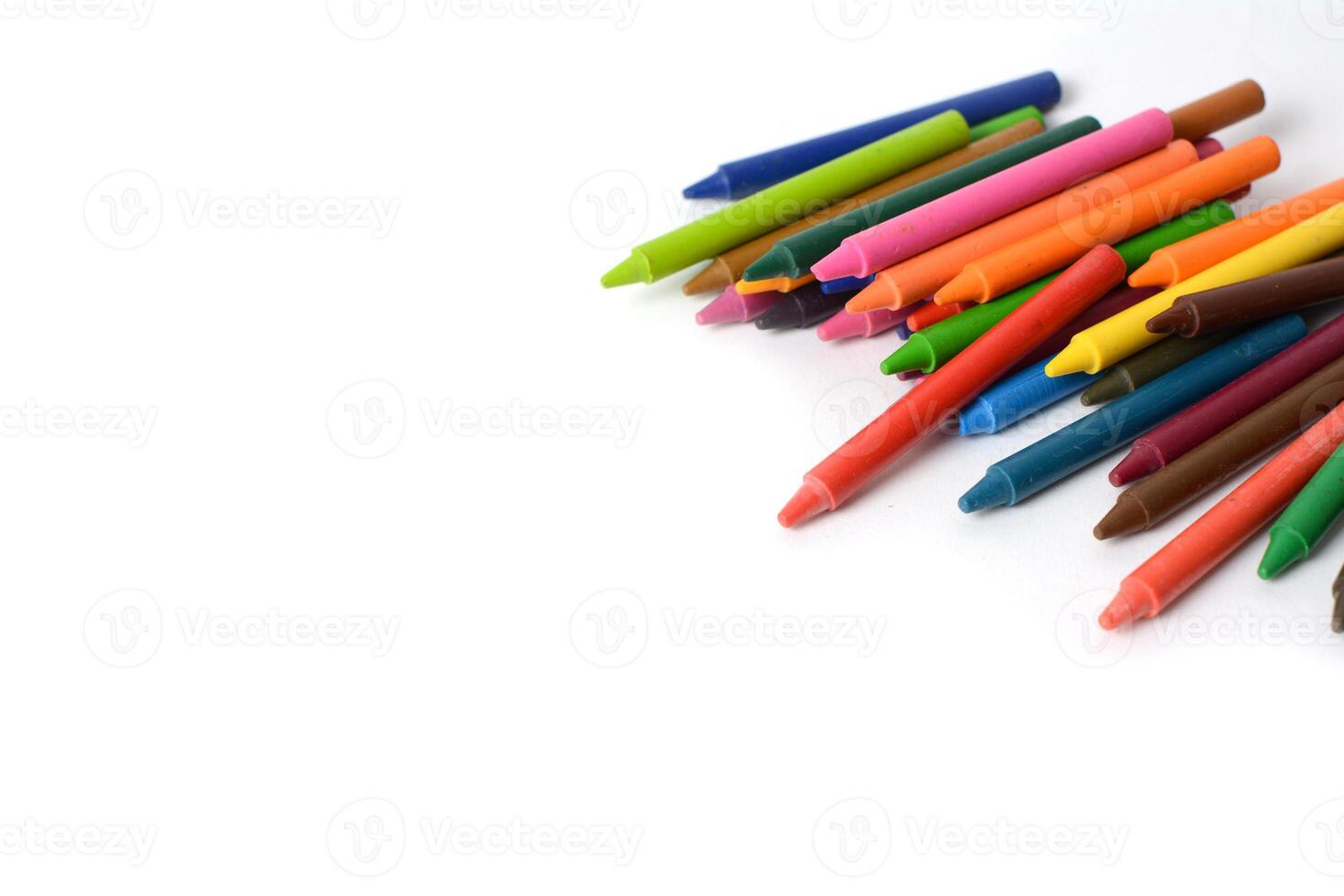 Crayons lined up isolated on white background. photo