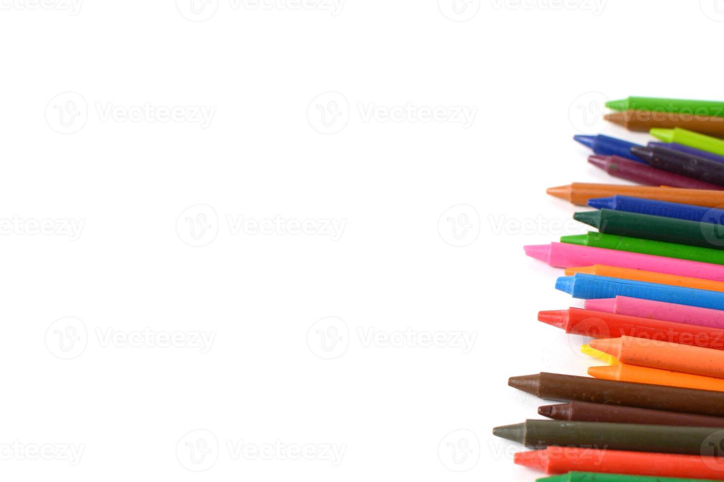 Crayons lined up isolated on white background. photo