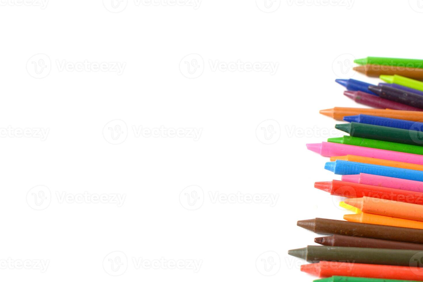 Crayons lined up isolated on white background. photo