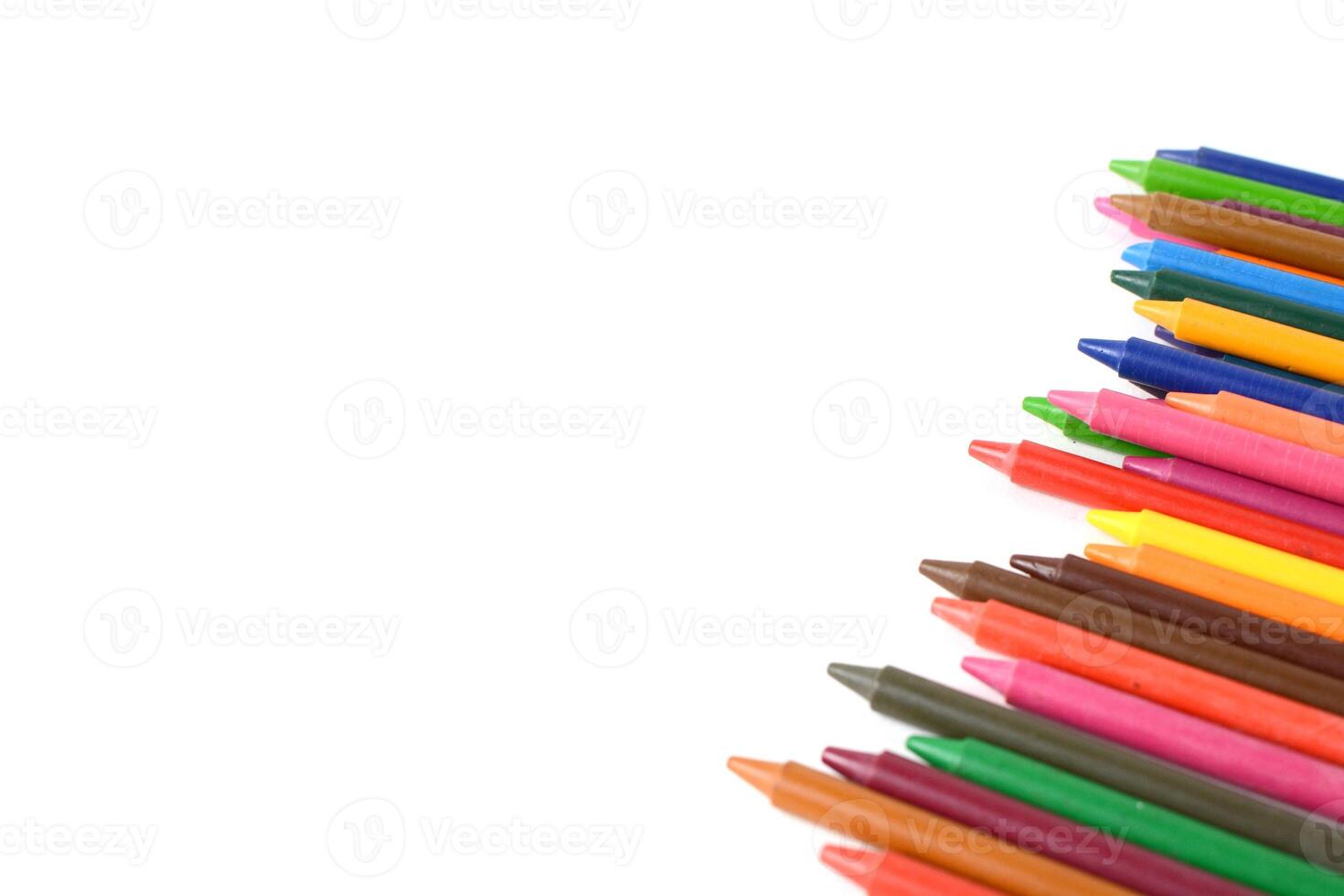 Crayons lined up isolated on white background. photo