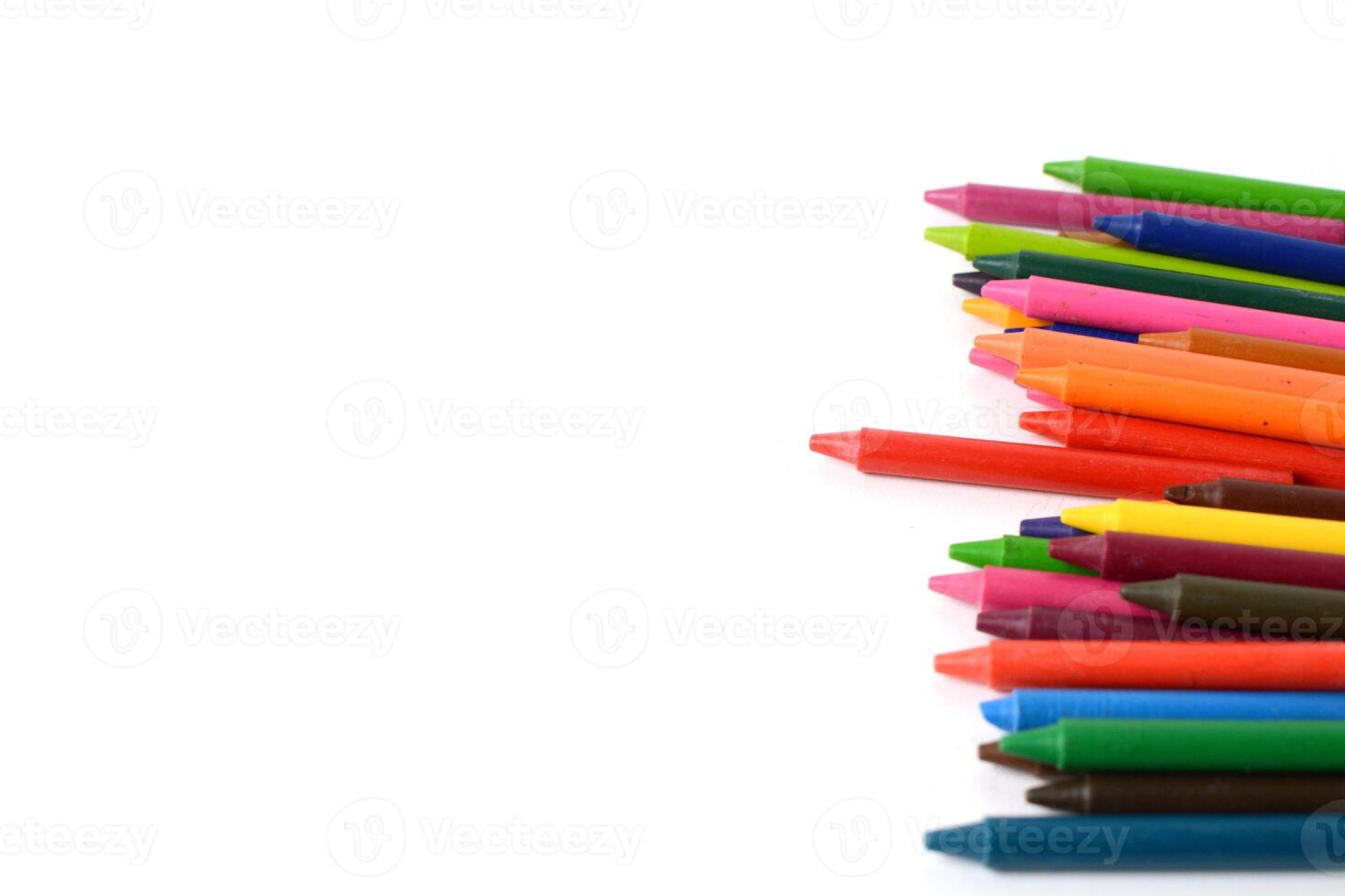 Crayons lined up isolated on white background. photo