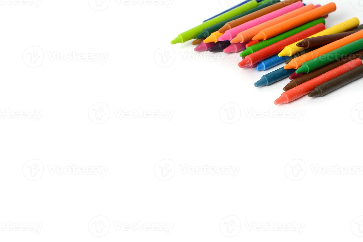 Crayons lined up isolated on white background. photo