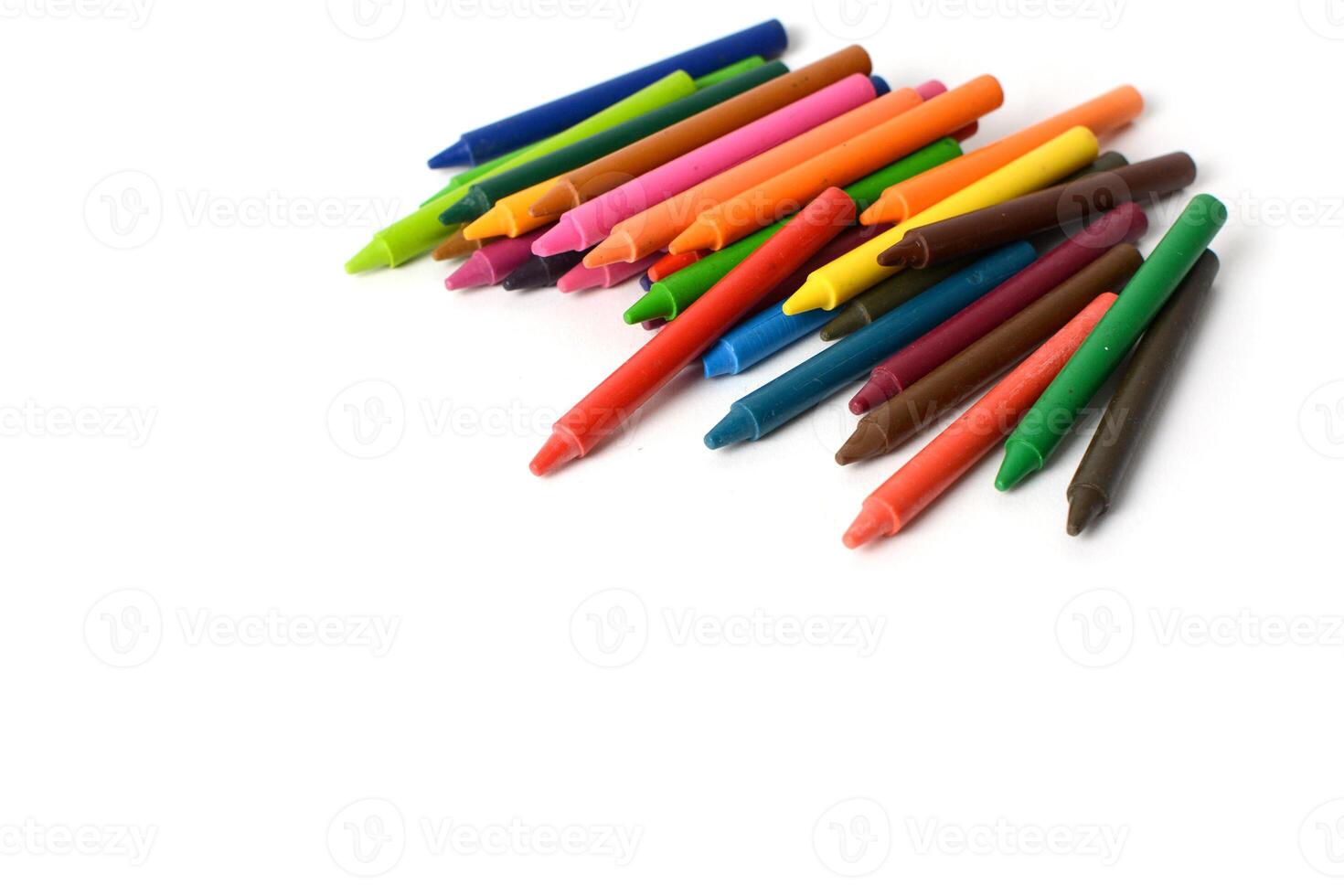 Crayons lined up isolated on white background. photo