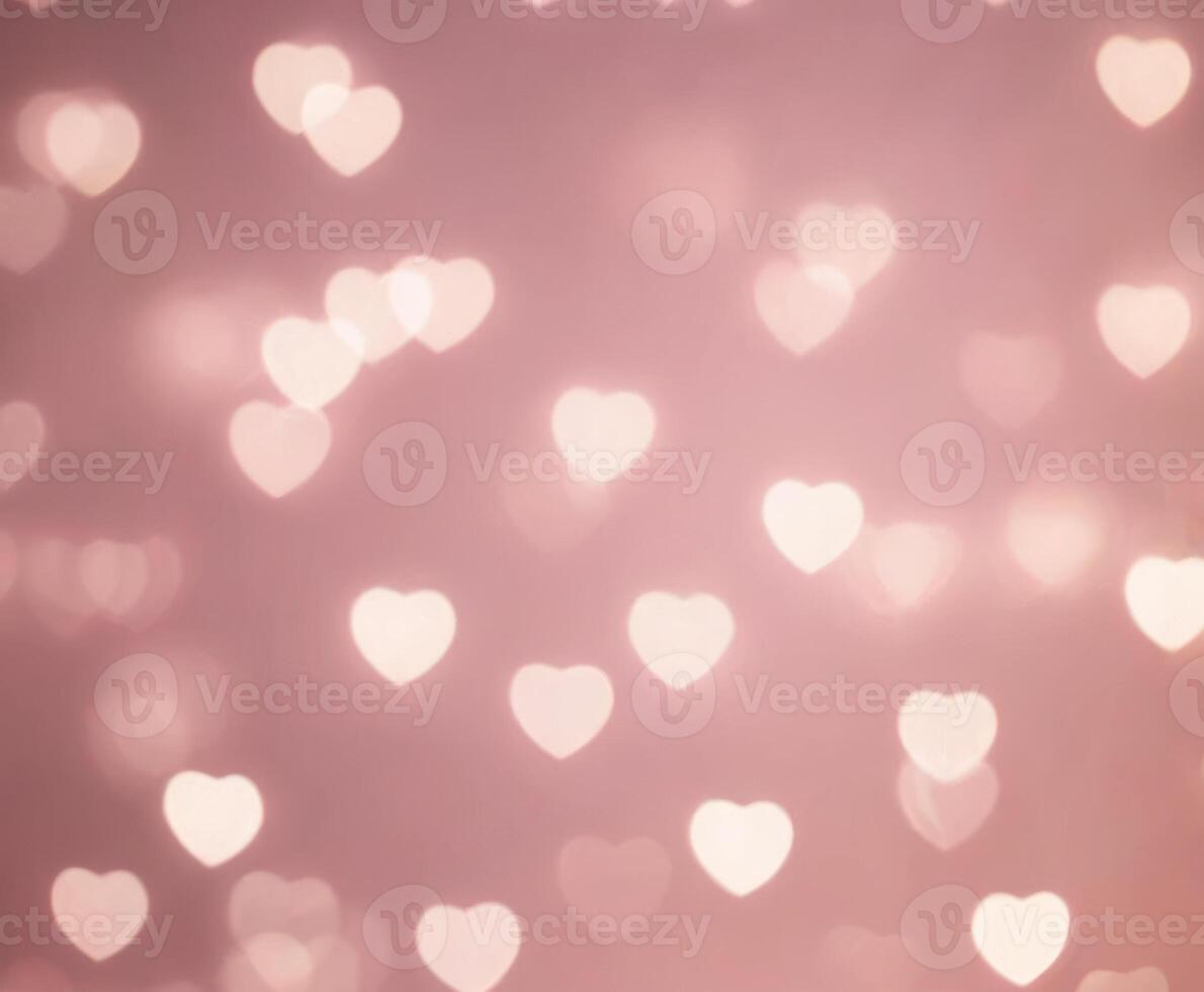 Pink blurred abstract background with cute bokeh hearts. photo
